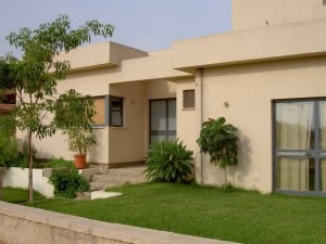 בית עץ בחיפוי שליכט בכפר חגלה.